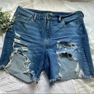 High Rise Medium Wash Ripped Denim Shorts
